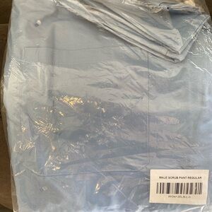 Two L Men’s Walgreens Ceil blue scrub tops and one pair of L Men’s scrub bottoms